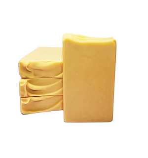 Four bars of Baroness of Butter soap. The soap bars are a creamy yellow color.