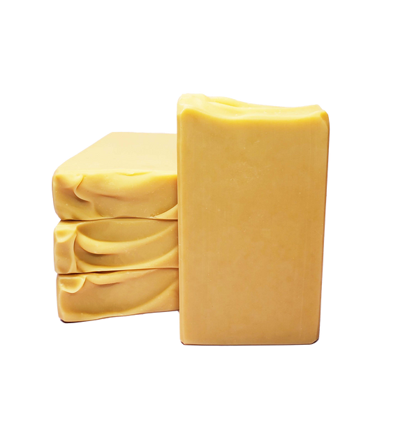 Four bars of Baroness of Butter soap. The soap bars are a creamy yellow color.