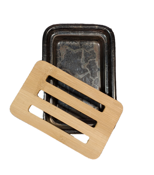 A dark brown, rectangular ceramic soap dish accompanied by a bamboo slotted tray.