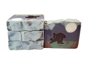 Four bars of Rougarou soup, with a moon, silhouette of a werewolf, swampy ground, and navy sky.