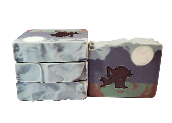 Four bars of Rougarou soup, with a moon, silhouette of a werewolf, swampy ground, and navy sky.